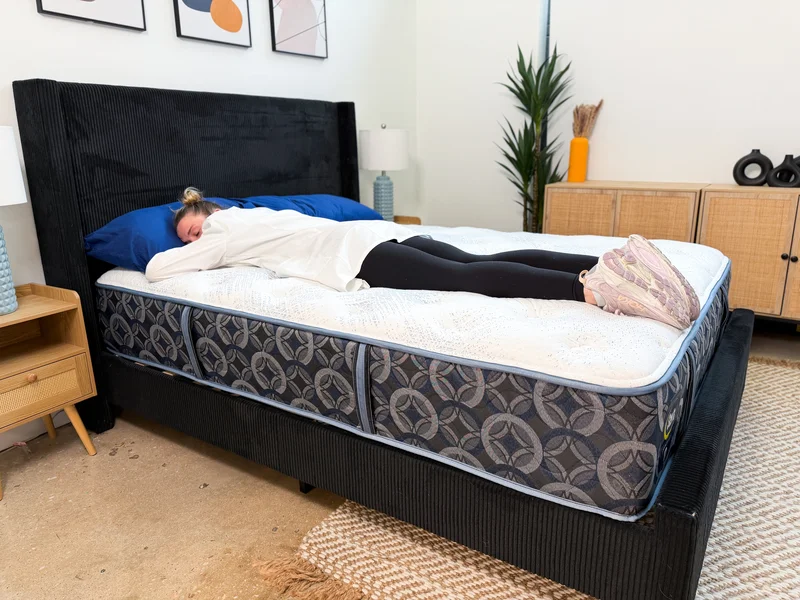 Tester stomach sleeping on the Serta Perfect Sleeper Cascade Range Medium mattress