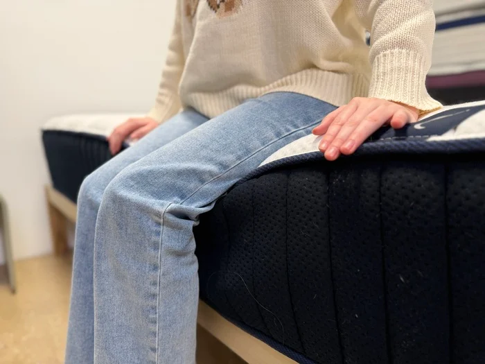 dreamcloud classic hybrid mattress edge support seated2