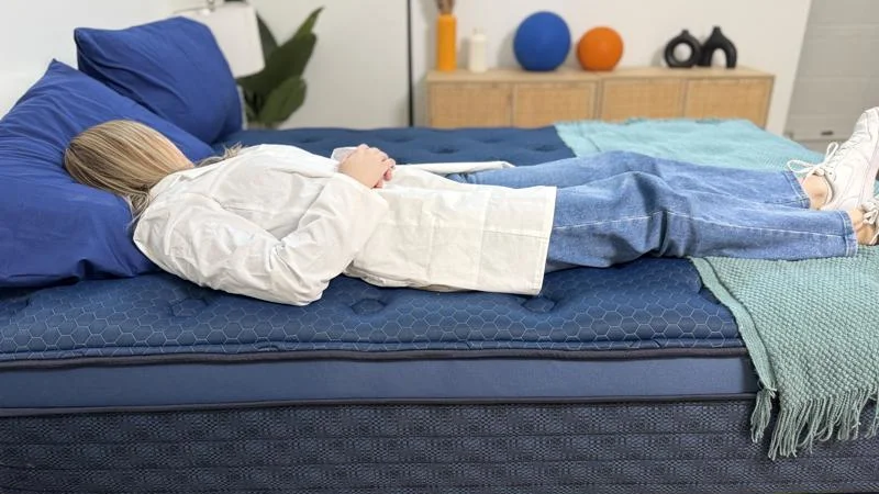Our tester back-sleeping on the Brooklyn Bedding Signature Hybrid Mattress