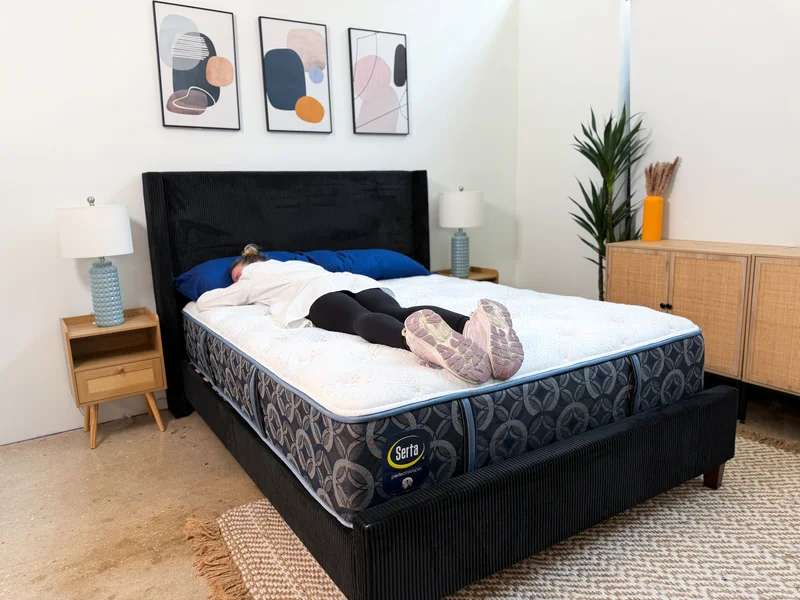 Tester stomach sleeping on the Serta Perfect Sleeper Cascade Range Medium mattress