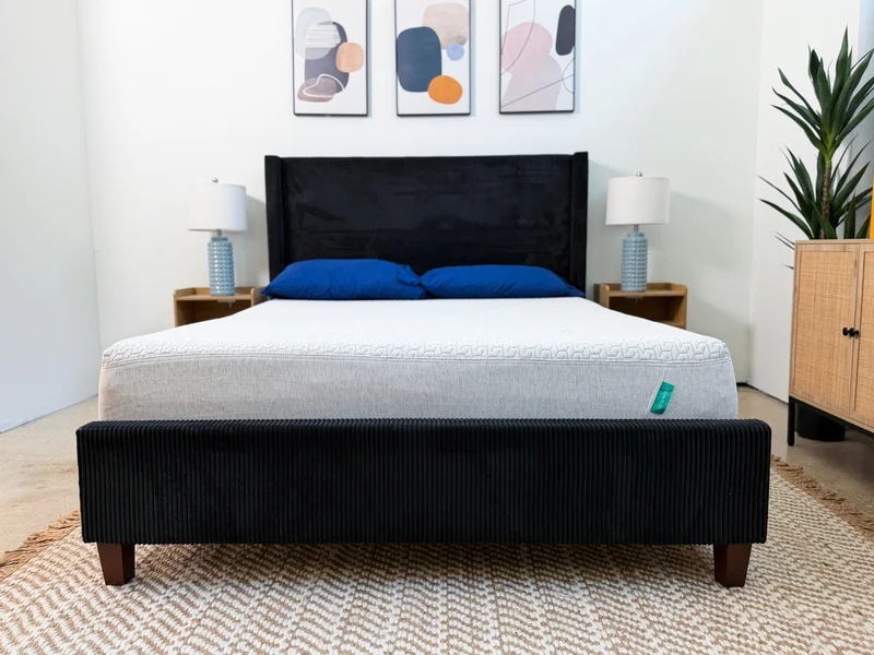 Tuft and Needle Original mattress on a black upholstered bed frame