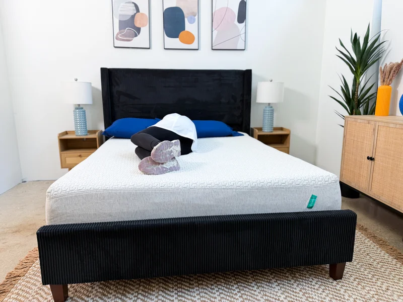 A tester lies on her side on the Tuft and Needle Original mattress