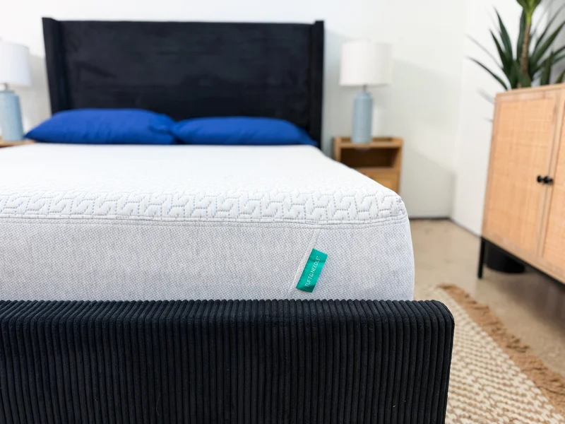 Tuft and Needle Original mattress on a black upholstered bed frame