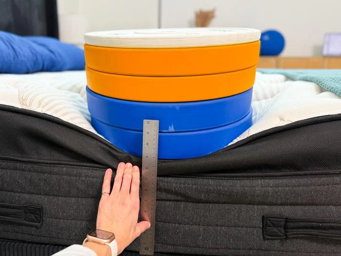 measuring the deflection of weight plates along the edge of the nolah evolution luxury firm