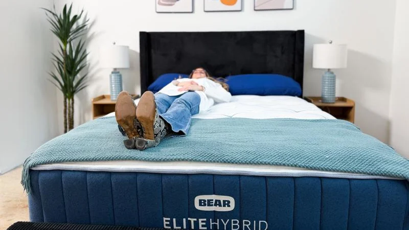 Our tester back-sleeping on the Bear Elite Hybrid Mattress
