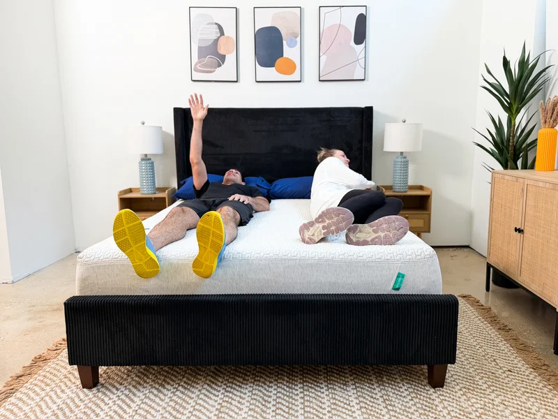 Two testers measuring motion isolation on the Tuft and Needle Original mattress